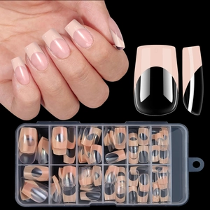 Detailed set of nude pink French square press-on nails with black tips in packaging