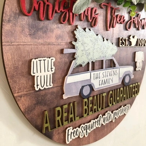 Detail shot of 3D layered wood Christmas Tree Farm door sign with rustic textures