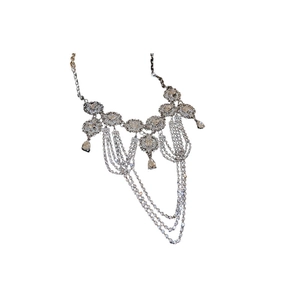 Elegant silver tassel necklace with geometric diamond-encrusted fringe and drop pendant
