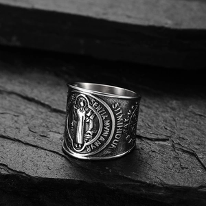 Vintage Saint Benedict medal ring in silver stainless steel on grey stone background