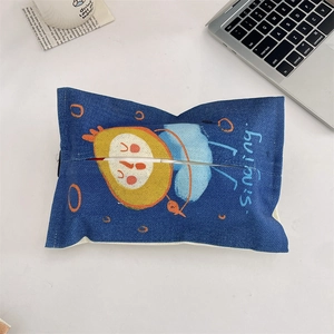 Detailed macro view of the dark blue linen car tissue bag with a cartoon bird pattern