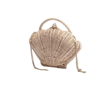 Chic beige shell-shaped woven straw bag with metal chain strap for beach vacations