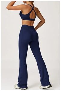 Detail view of yoga set featuring racerback bra and flared leggings with side pockets