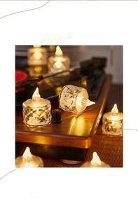 Detail of crystal texture LED tea light candles with warm yellow light on vintage player