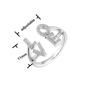 Macro shot of silver adjustable LOVE ring with micro-pave cubic zirconia crystals