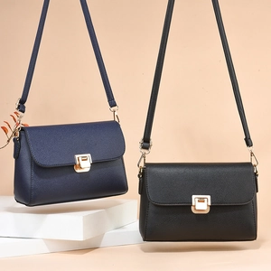 Litchi texture leather crossbody bags in black and navy blue with gold metal buckles