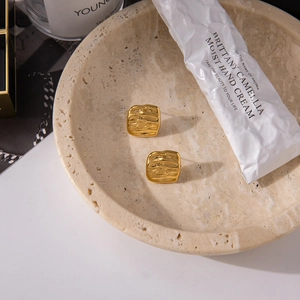 Detail showing the hammered texture of 18K gold stainless steel geometric square earrings