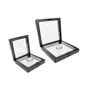 Dual-size black PE film jewelry display frames showing ring suspension effect on white base