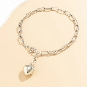 Minimalist silver heart pendant necklace with industrial rectangle link chain and toggle clasp
