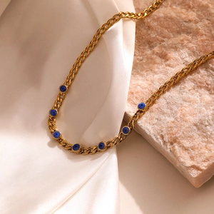 18K gold plated titanium necklace with blue evil eye pendants on silk and stone
