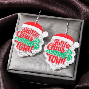 Cartoon acrylic Santa Claus drop earrings with festive text on jewelry box background