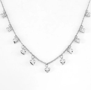 Detailed view of silver heart charms on a sleek dainty chain necklace for women