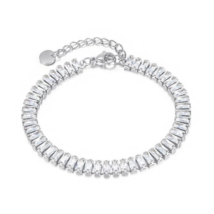 Detail of silver tennis bracelet featuring rectangular zircon stones and lobster clasp
