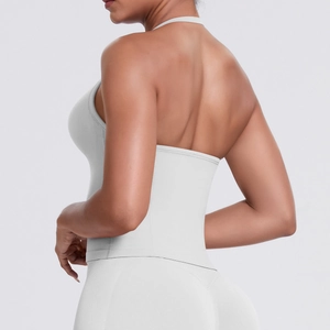 Detail view showing backless cross-strap sports bra and high-waisted shaping yoga pants