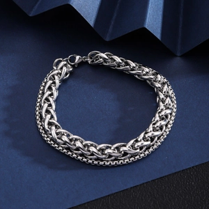 Detail view of silver stainless steel double-layered cuban and box chain bracelet