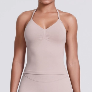 Close-up of pink seamless yoga tank top with ruched chest detail and halter neckline