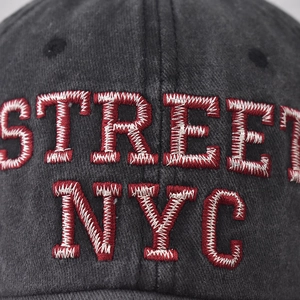 Washed dark grey cotton baseball cap featuring bold red STREET NYC 3D embroidery