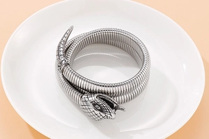 Detailed close-up of double-wrap snake bracelet showing intricate scale texture and silver head