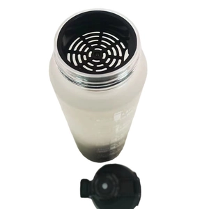 Frosted gradient water bottle with black tea filter and flip top lid on white background