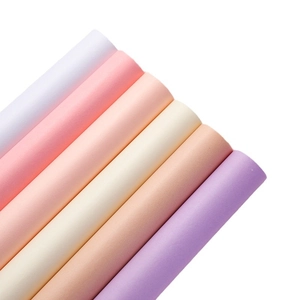 Rolls of white and macaron colored tissue paper for flower and gift bouquet packaging