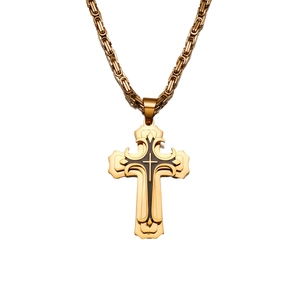 Detailed view of a gold double-layered cross pendant with Byzantine chain for men