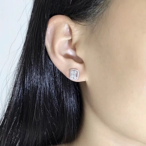 Elegant emerald cut cubic zirconia stud earrings with halo setting in silver finish