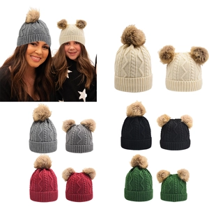 Winter knit pompom beanie for mother and daughter with cable knit patterns