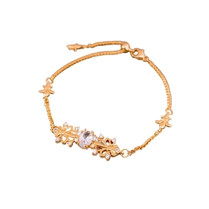 Vintage zircon iris pull-out bracelet in gold with oval center stone on white backdrop