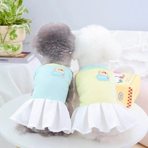 Blue and yellow pet dresses with pleated skirts for small dogs and cats seen from behind