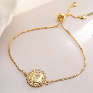 Adjustable gold plated bracelet with a zircon-encrusted Virgin Mary circular charm pendant