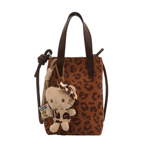 Leopard print crossbody tote bag with adjustable shoulder strap and cute plush charm