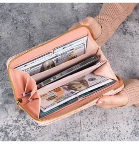 Detailed view of the large capacity interior layout in this pink leather zip wallet