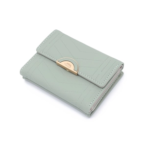 Detail of light green tri-fold wallet with V-quilt pattern and gold logo buckle