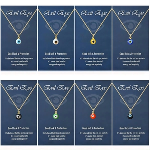 Set of eight stainless steel evil eye necklaces in various colors on blue cards