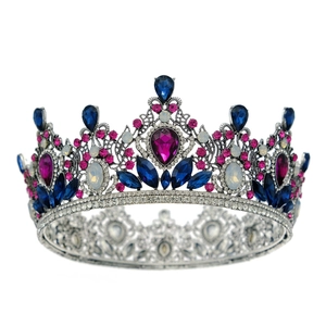Detailed close-up of Baroque bridal crown with colorful rhinestones and blue crystals