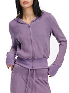 Detailed view of purple zip-up hoodie featuring ribbed cuffs and side pocket design