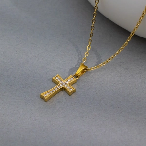 Gold plated cross pendant necklace with white cubic zirconia on a simple chain