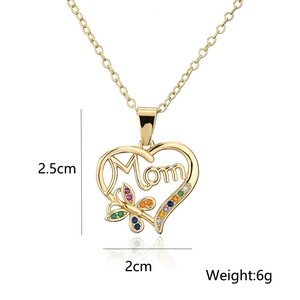 Macro detail of MOM pendant with dimensions 2.5cm by 2cm and weight 6g in gold finish