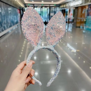 Sparkly pink sequin rabbit ear headband with white glitter wrap for festive celebrations