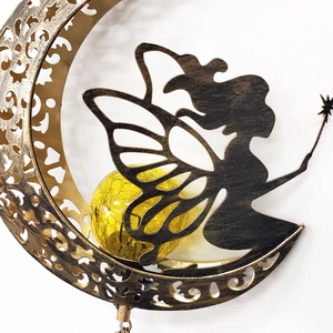 Detailed view of hollow moon and fairy solar garden wind chime with crackle glass ball