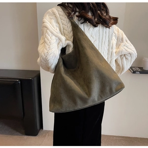 Deep green faux suede tote bag shown from a back view to highlight large capacity and fit