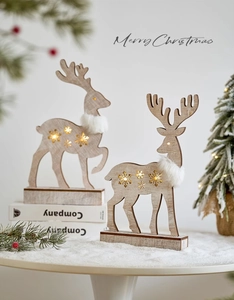 Detailed view of wooden Christmas reindeer with hollow snowflake LED light decoration