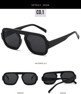 Detailed view showing wide temples and dark lenses of the black pilot sunglasses