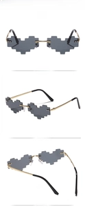 Macro detail of gold metal frames and gray pixelated heart lenses on unique sunglasses