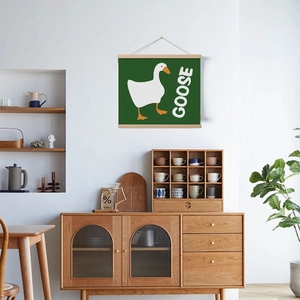 Minimalist white goose scroll wall art in dark green hanging in a cozy Nordic living room
