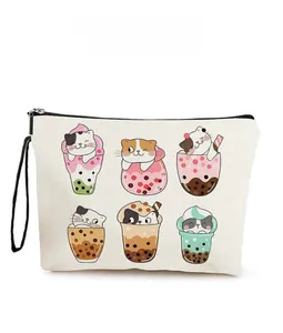 Detail of cream canvas pouch featuring cute cat milk tea prints and black zipper handle