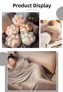 Close-up of cat paw plush pillows with warm hand pockets and matching fleece blankets