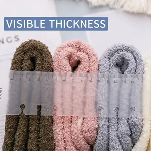 Thick coral fleece socks for winter warmth showing 4cm thickness with a measuring scale