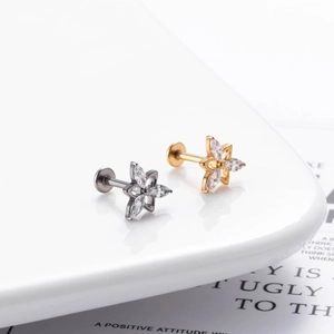 Titanium flower labret stud with zircon petals in gold and silver finish