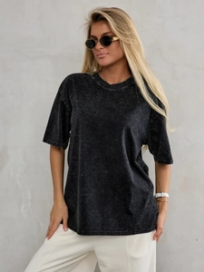 Close-up of oversized acid wash cotton T-shirt showing vintage texture and drop shoulder